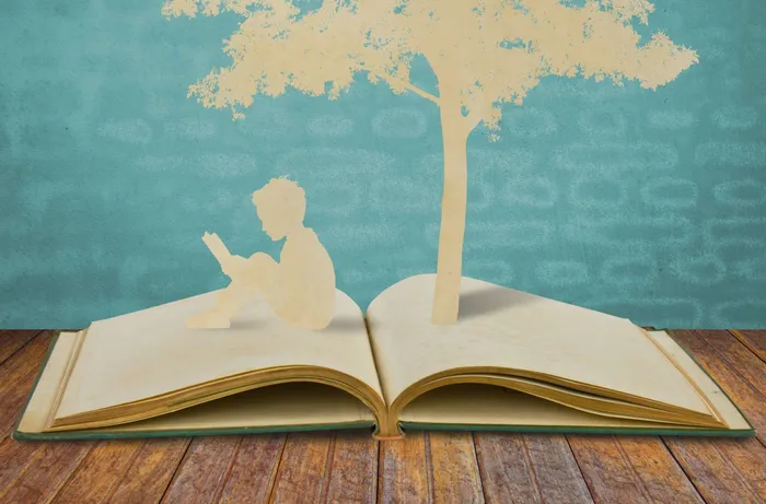 silhouettes-of-a-tree-and-a-man-on-a-book-scaled